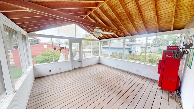 unfurnished sunroom with a ceiling fan and a wealth of natural light