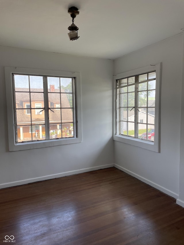 302 E Main St, Greenfield, IN 46140 - unfurnished room with plenty of natural light and dark wood-style flooring