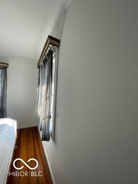 302 E Main St, Greenfield, IN 46140 - bedroom featuring wood finished floors and ornamental molding