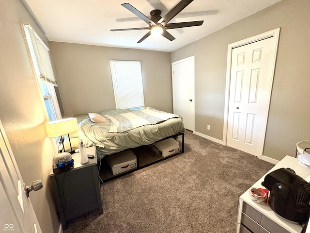 carpeted bedroom with a ceiling fan and baseboards