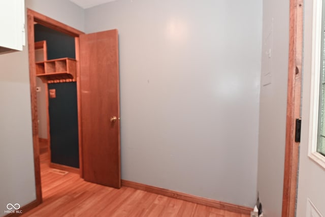 unfurnished bedroom featuring light wood finished floors