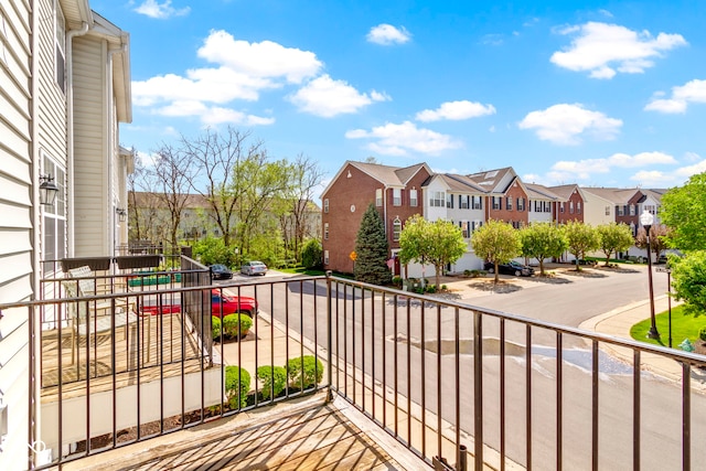 balcony featuring a residential view