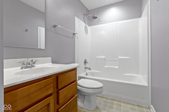 bathroom with washtub / shower combination, vanity, and toilet