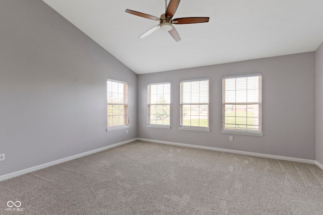 unfurnished room with baseboards, ceiling fan, carpet, and lofted ceiling