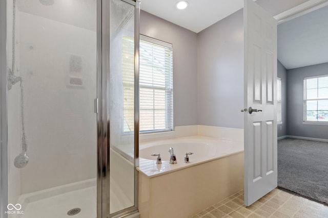 full bath featuring a bath and a shower stall
