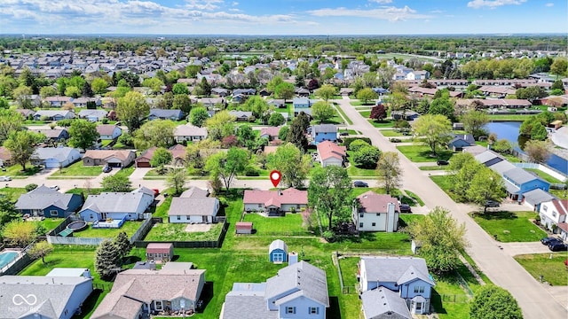 birds eye view of property with a residential view