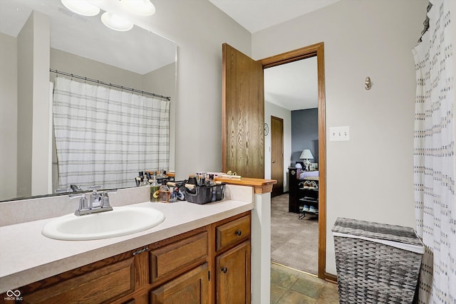 ensuite bathroom featuring ensuite bathroom and vanity