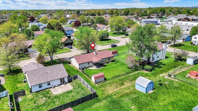 birds eye view of property with a residential view
