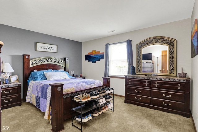 bedroom with light colored carpet and visible vents