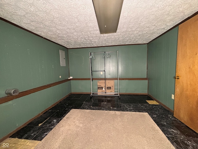 spare room featuring baseboards and ornamental molding