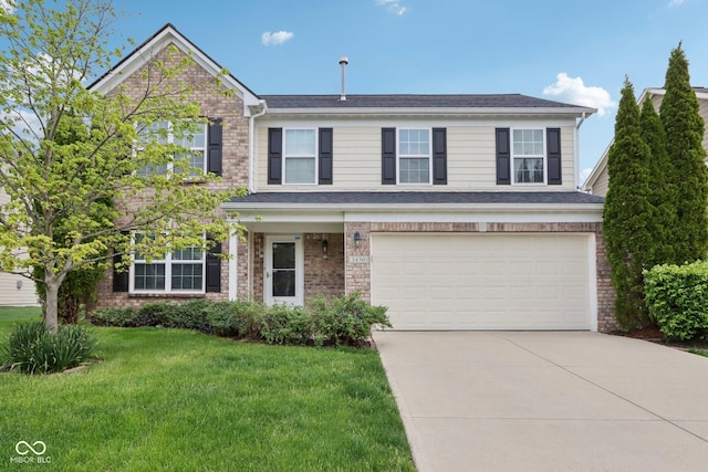 traditional-style house with brick siding, a garage, a front lawn, and driveway