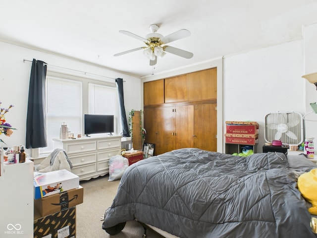 carpeted bedroom featuring a ceiling fan