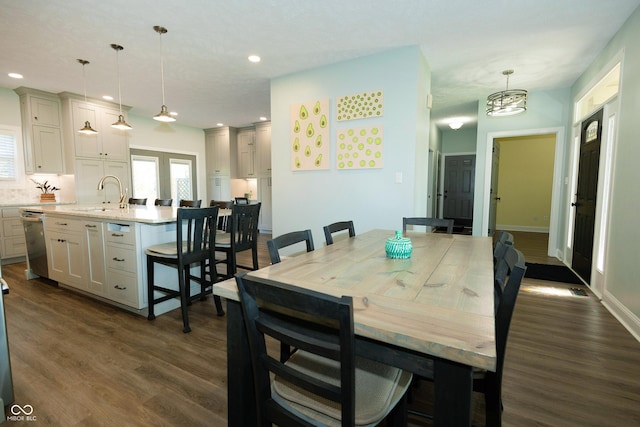 dining space with recessed lighting and dark wood-style flooring