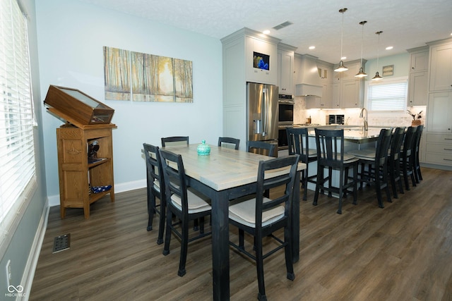 dining area with recessed lighting, baseboards, visible vents, and dark wood-type flooring