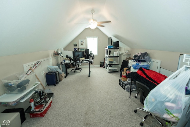 carpeted office with ceiling fan and vaulted ceiling