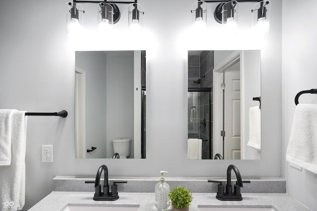 1417 E Michigan St, Indianapolis, IN 46201 - bathroom featuring vanity, a stall shower, and toilet