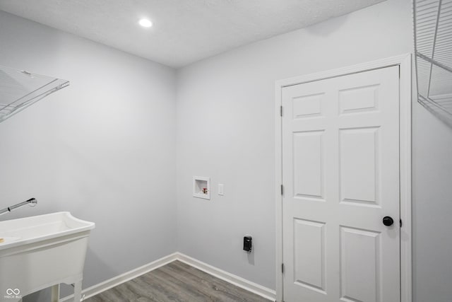 1417 E Michigan St, Indianapolis, IN 46201 - clothes washing area with laundry area, wood finished floors, baseboards, hookup for a washing machine, and recessed lighting