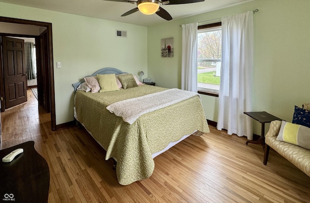 2405 Sycamore St, Columbus, IN 47201 - bedroom featuring wood finished floors, baseboards, and a ceiling fan