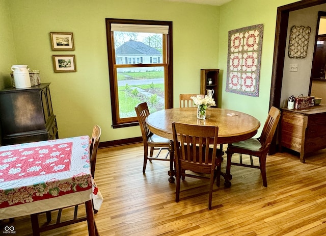 2405 Sycamore St, Columbus, IN 47201 - dining area with light wood-style flooring and baseboards