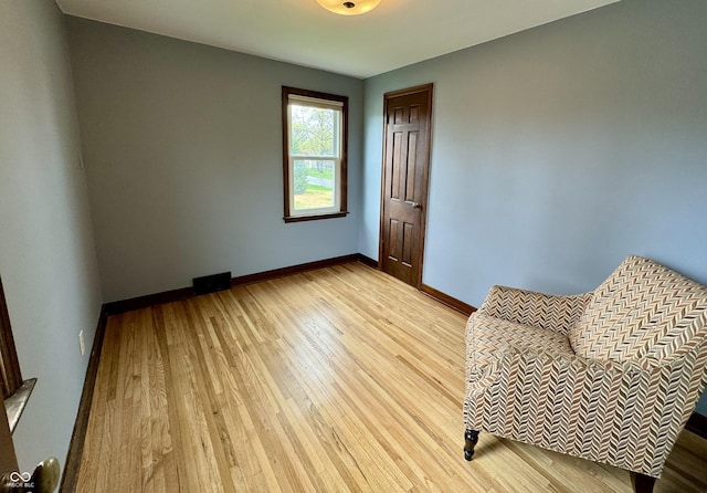 2405 Sycamore St, Columbus, IN 47201 - living area featuring light wood-style flooring and baseboards
