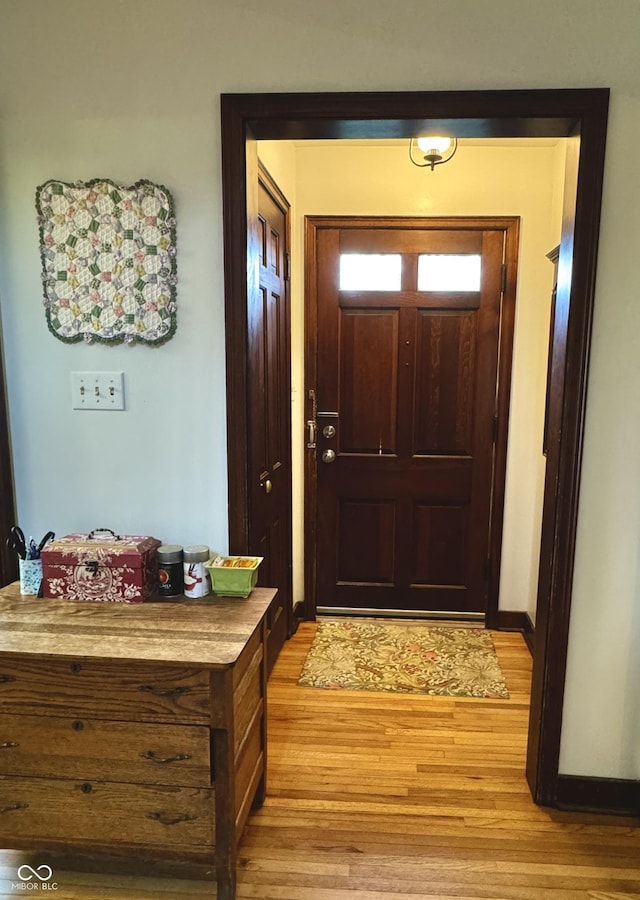 2405 Sycamore St, Columbus, IN 47201 - doorway to outside featuring light wood-style floors and baseboards