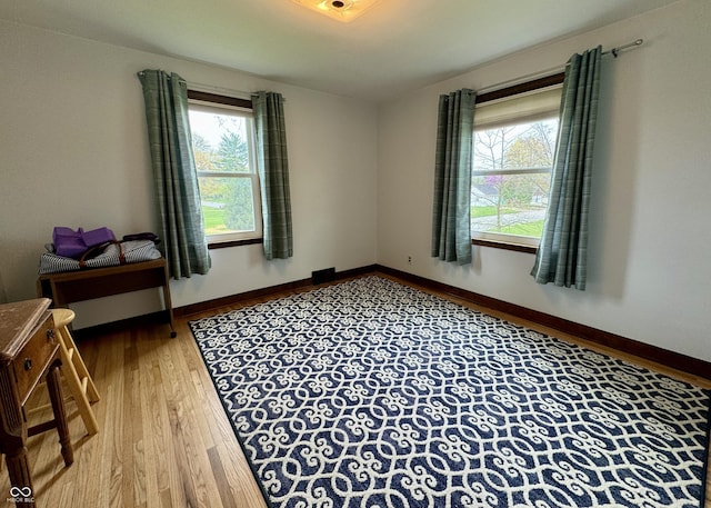 2405 Sycamore St, Columbus, IN 47201 - unfurnished room featuring healthy amount of natural light, wood finished floors, and baseboards