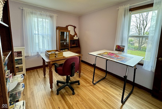2405 Sycamore St, Columbus, IN 47201 - office area with light wood-type flooring, healthy amount of natural light, and baseboards