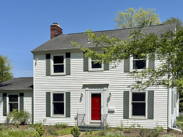 2405 Sycamore St, Columbus, IN 47201 - view of front of home with a shingled roof and a chimney