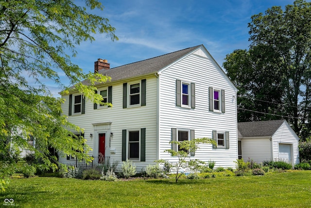 2405 Sycamore St, Columbus, IN 47201 - view of front of home with a chimney, a front yard, and a shingled roof