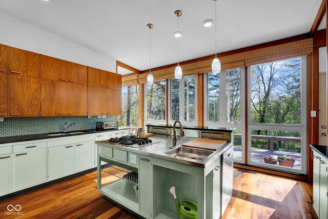 kitchen with a sink, plenty of natural light, and stainless steel gas cooktop
