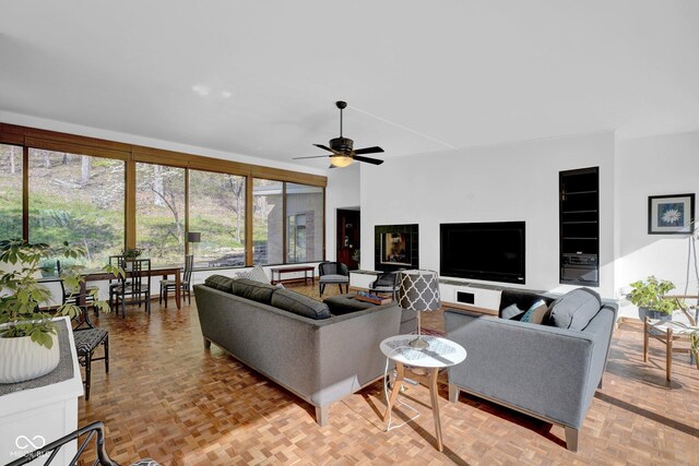 living area featuring a ceiling fan