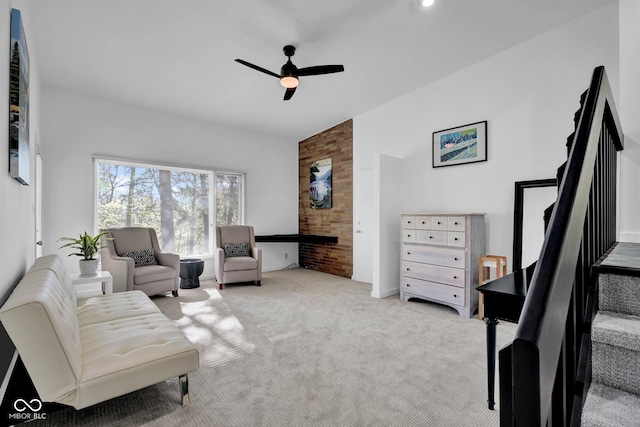 living room with carpet floors, a ceiling fan, and lofted ceiling