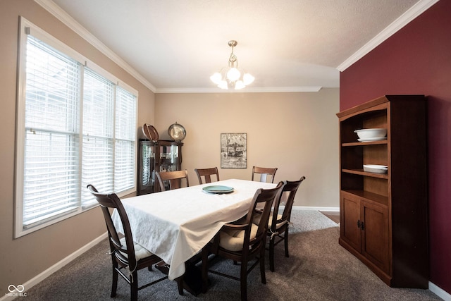 dining room with crown molding, baseboards, plenty of natural light, and a notable chandelier
