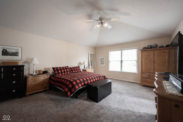bedroom with carpet floors, a ceiling fan, baseboards, and lofted ceiling