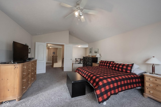 carpeted bedroom with ceiling fan and vaulted ceiling
