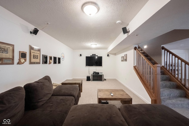 carpeted living area featuring stairs and a textured ceiling