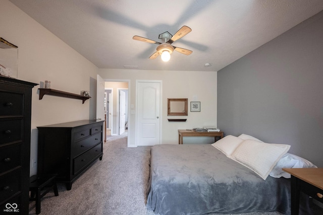 bedroom featuring visible vents, carpet flooring, and ceiling fan