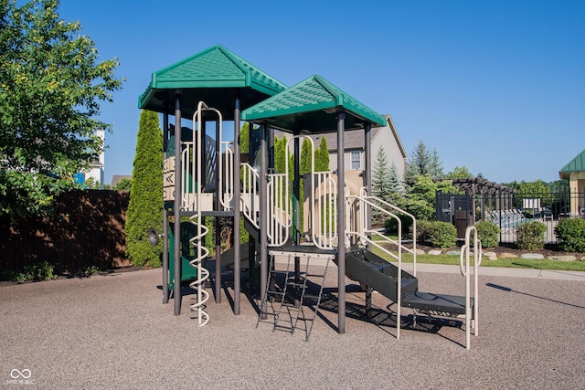 communal playground featuring fence