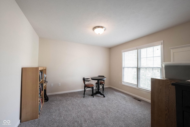 office featuring visible vents, carpet, and baseboards