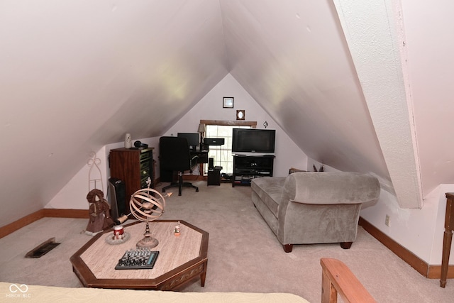 114 E 27th St, Indianapolis, IN 46205 - carpeted living room featuring vaulted ceiling, baseboards, and an office area