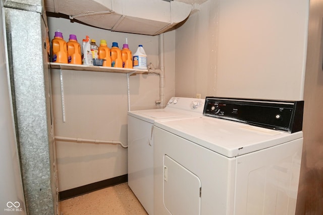 114 E 27th St, Indianapolis, IN 46205 - washroom with washing machine and clothes dryer and baseboards