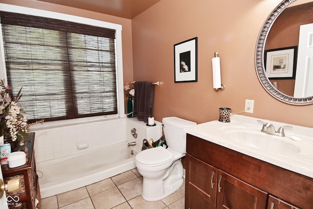 114 E 27th St, Indianapolis, IN 46205 - bathroom with toilet, tile patterned flooring, a tub, and vanity