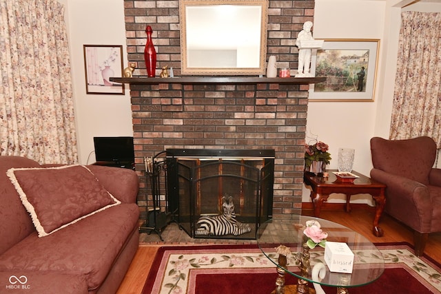 114 E 27th St, Indianapolis, IN 46205 - living area featuring a fireplace and wood finished floors