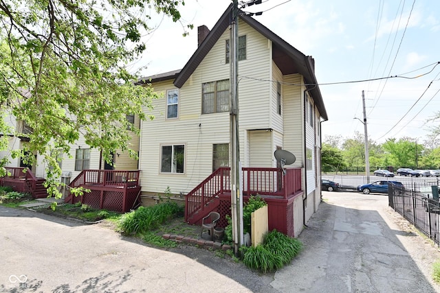 114 E 27th St, Indianapolis, IN 46205 - view of front of home featuring fence and a chimney