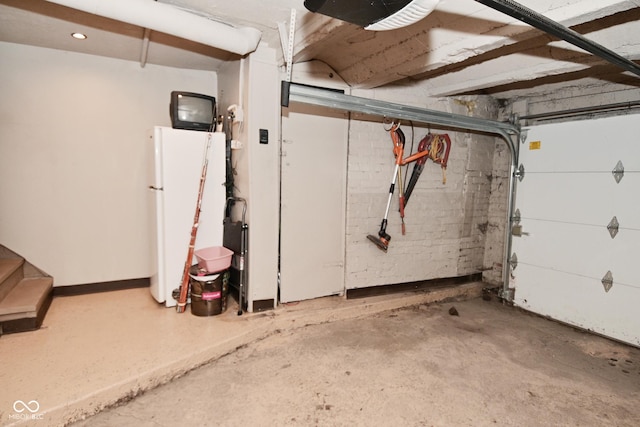 114 E 27th St, Indianapolis, IN 46205 - garage featuring freestanding refrigerator and recessed lighting
