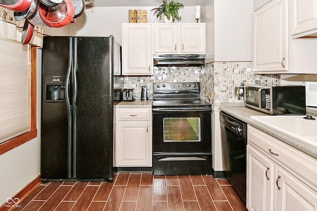 114 E 27th St, Indianapolis, IN 46205 - kitchen with black appliances, under cabinet range hood, wood tiled floors, and light countertops