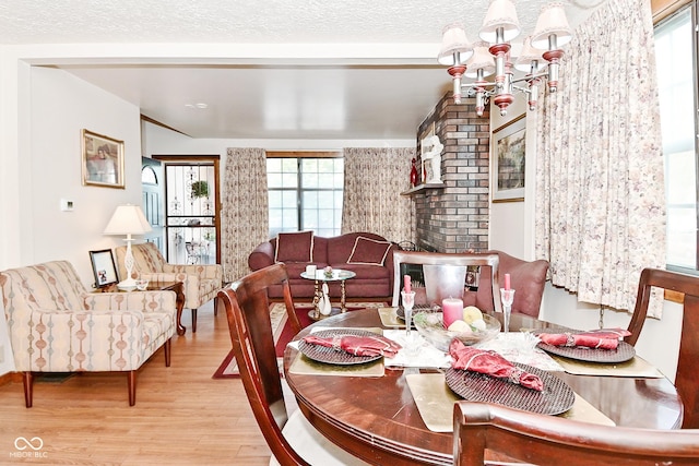 114 E 27th St, Indianapolis, IN 46205 - dining area featuring wood finished floors and a chandelier