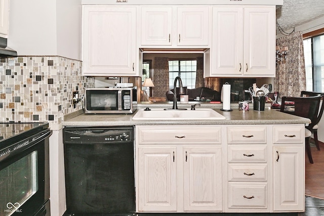 114 E 27th St, Indianapolis, IN 46205 - kitchen featuring black appliances and white cabinetry