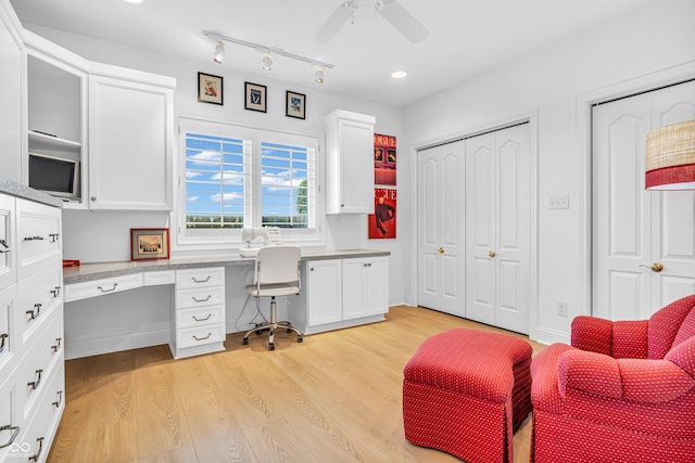 office space featuring built in study area, recessed lighting, ceiling fan, and light wood-type flooring