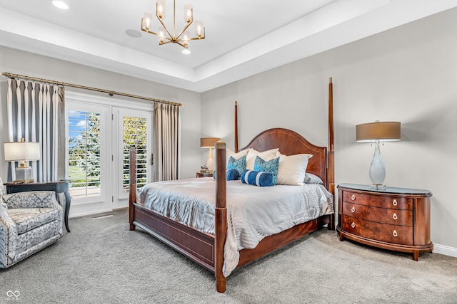 carpeted bedroom with baseboards, access to outside, recessed lighting, a raised ceiling, and a chandelier
